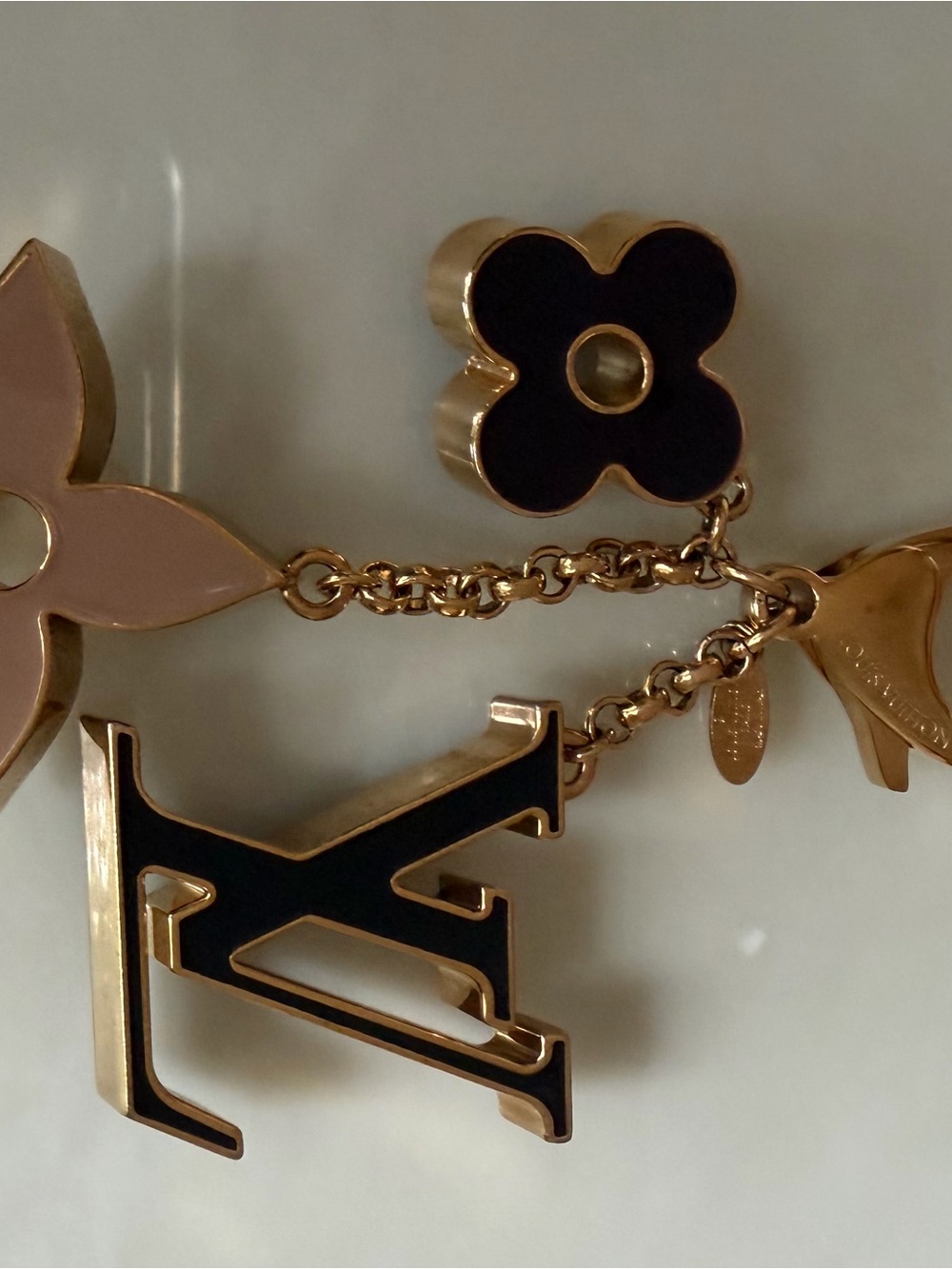Louis Vuitton Gold-Tone bag charm with Black and Pink Enamel Charms